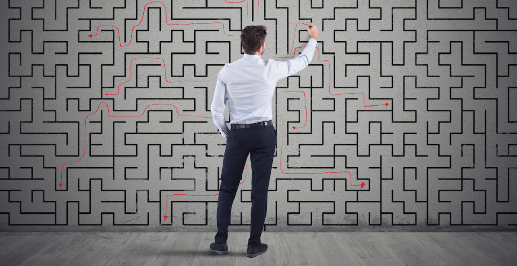 Man in a maze solving a problem