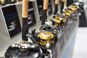 fishing reels lined up for sale